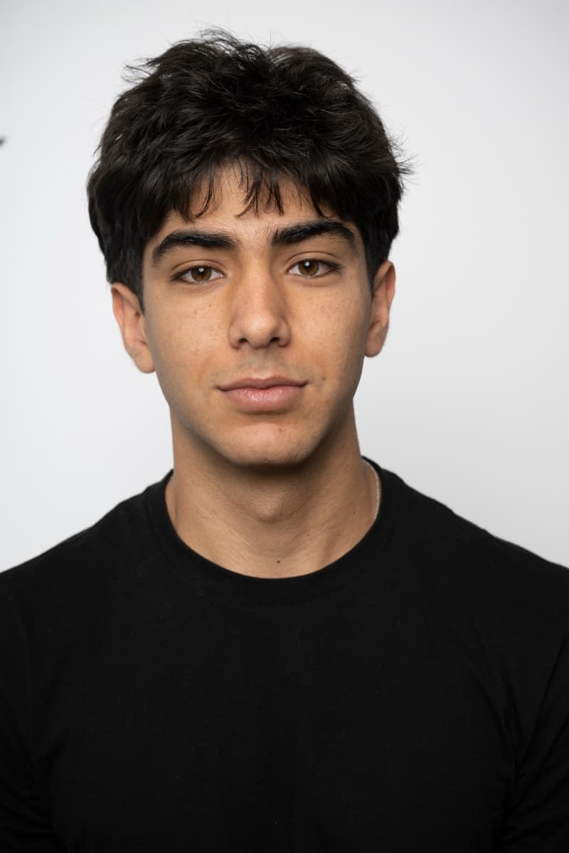 Kasra Rategh, head and shoulders, against a plain studio background.
